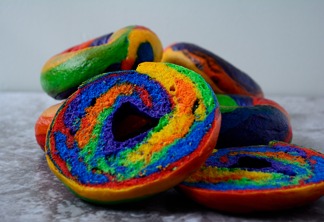 Swirls of beautiful colours are at the centre of these cool rainbow bagels