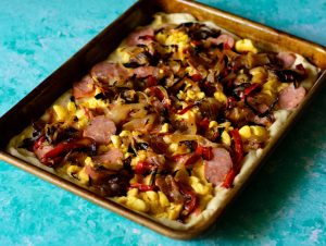 Make-your-focaccia-a-complete-meal-by-stuffing-it,-this-one-is-filled-with-creamy-ackee-smoky-andouille-sausage-charred-onions-and-red-peppers