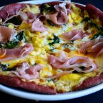 prosciutto-and-greens-ackee-flatbread-on-beetroot-pizza-dough