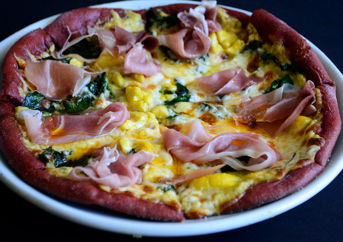 prosciutto-and-greens-ackee-flatbread-on-beetroot-pizza-dough