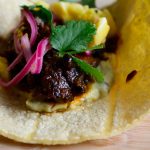 Juicy-oxtail-on-top-buttery-ackee-bean-spread-with-roasted-poblano