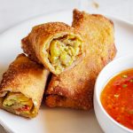 Fill egg roll wraps with ackee and saltfish to make this favorite jamaican dish into a crowd pleasing appetizer for any party