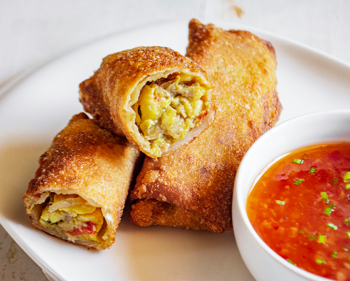 Fill egg roll wraps with ackee and saltfish to make this favorite jamaican dish into a crowd pleasing appetizer for any party