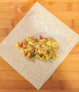 how-to-make-ackee-and-saltfish-springrolls-using-a-portion-scoop-to-add-filling-ensures-equal-amounts-are-placed-in-each-roll