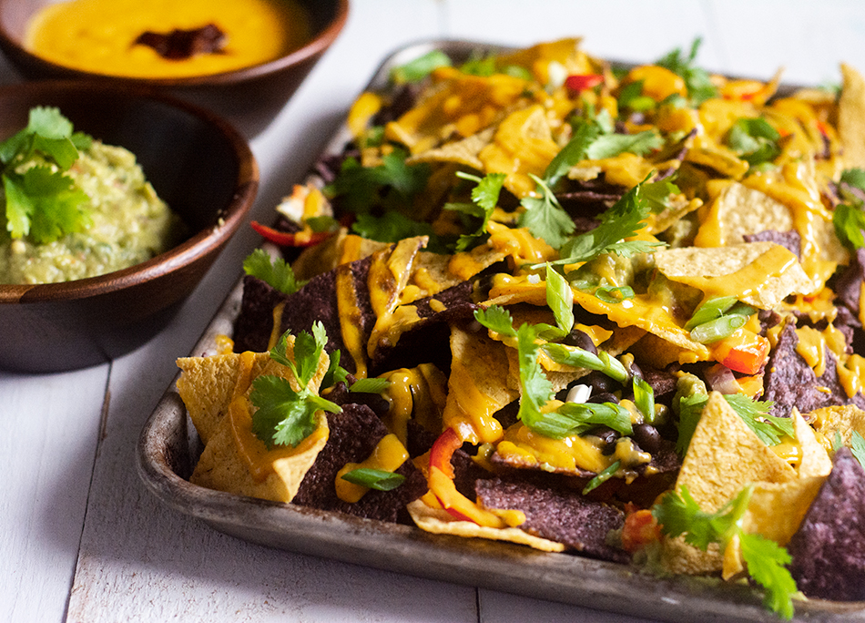 Serve-baked-nachos-layered-with-beans-peppers-onions-and-ackee-nacho-cheese